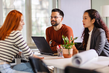 Coworkers talking about serious topics in their office on the job