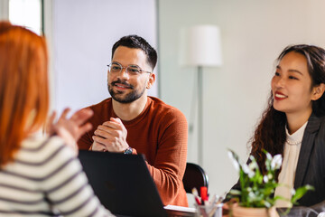 Coworkers talking about serious topics in their office on the job