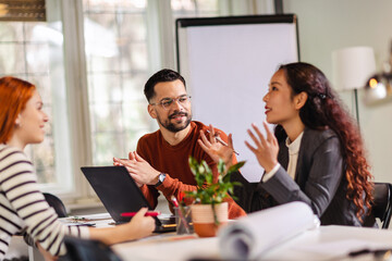 Coworkers talking about serious topics in their office on the job