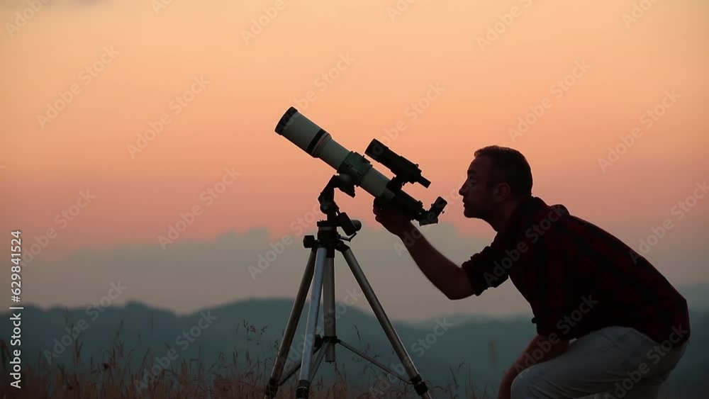 Canvas Prints astronomer looking at the starry skies and crescent moon with a telescope.