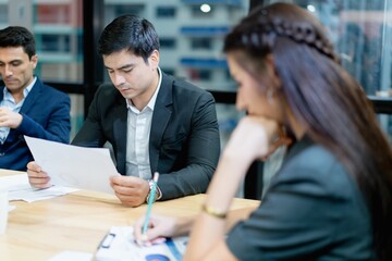 Energetic young entrepreneurs are brainstorming on their business strategy. and set goals Guidelines for doing business.