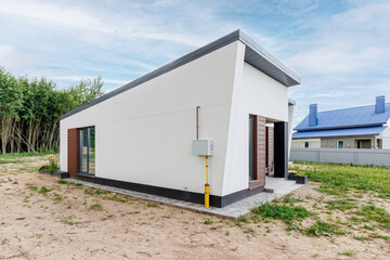View of a small modern house immediately after construction. Step house construction system
