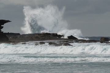 waves crashing on rocks