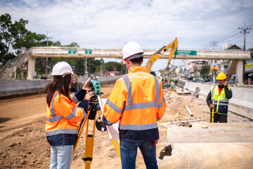 Portrait surveyors wearing uniform conversation and blueprint check inspection by theodolite camera...