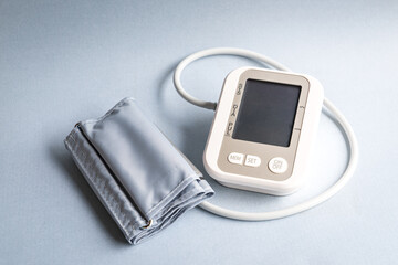 Digital blood pressure monitor device. Healthcare and medical concept.