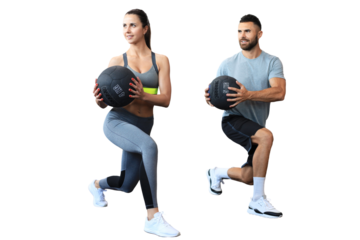 Beautiful young sports couple is working out with medicine ball on a transparent background