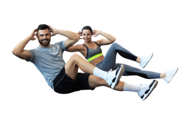 Attractive man and woman working in pairs performing sit ups on a transparent background