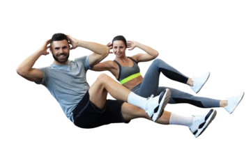 Fotobehang Persoonlijk Attractive man and woman working in pairs performing sit ups on a transparent background  © ty