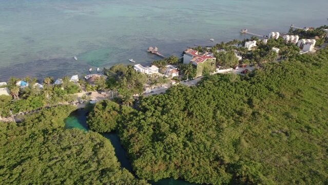 Aerial view above the Cenote and coastline of Alea, Tulum in Mexico.