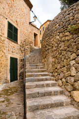 View of a medieval street in the Old Town of the picturesque Spanish-style village Fornalutx, Majorca or Mallorca island