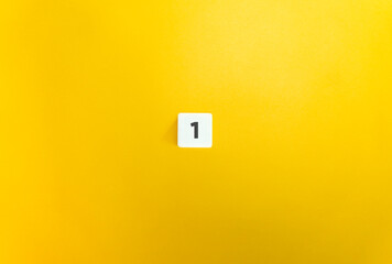 Number 1 on Letter Tile on Yellow Background. Minimal Aesthetic.