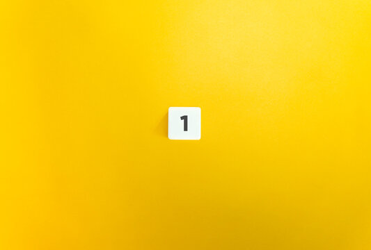 Number 1 on Letter Tile on Yellow Background. Minimal Aesthetic.