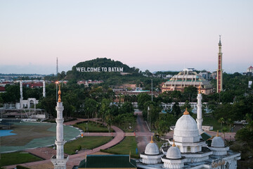 Batam city view. Batam city view with text "Welcome to Batam. View from the window in the city. Batam city landscape. Batam is an industrial city and the largest city in the Riau Islands.