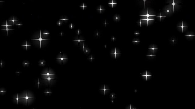 White glowing twinkling sparkles, particles stars trail transition on black background.