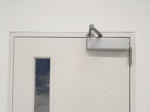 Door closer : A manual door closer stores the energy used in the opening of the door in a compression or torsion spring and releases it to close the door.