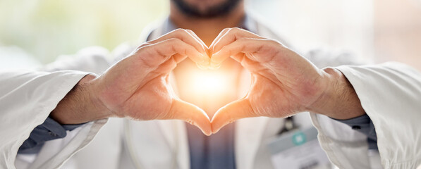 Medical, light and doctor heart hands for love, support and healthcare in a hospital or clinic by medicine professional. Trust, hope and worker with bright sign, symbol or gesture for cardiology - obrazy, fototapety, plakaty