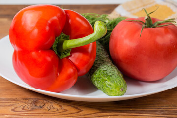 Various fresh vegetables as salad ingredients on the dish