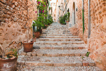 View of a medieval street in the Old Town of the picturesque Spanish-style village Fornalutx, Majorca or Mallorca island