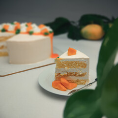 Delicious mango fruit cake on white surface