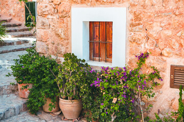 View of a medieval street in the Old Town of the picturesque Spanish-style village Fornalutx, Majorca or Mallorca island