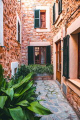 View of a medieval street in the Old Town of the picturesque Spanish-style village Fornalutx, Majorca or Mallorca island