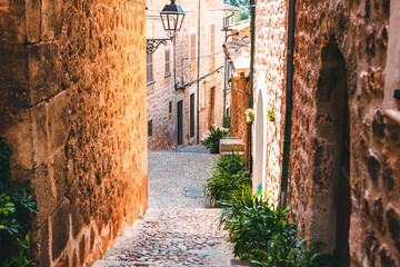 View of a medieval street in the Old Town of the picturesque Spanish-style village Fornalutx, Majorca or Mallorca island