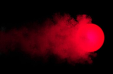 abstract background, glowing burning red ball with clouds and smoke on black background