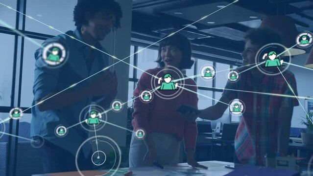 Animation of profile icons connecting with lines over happy diverse colleagues discussing in office