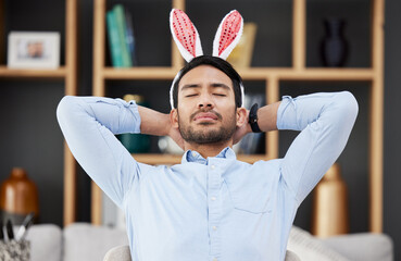 Bunny ears, easter and business man sleeping or tired in an office feeling lazy on holiday and...