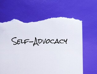 Torn paper on blue background with handwriting SELF ADVOCACY means ability to speak-up for...