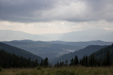 Naklejka na ściany i meble Mountain View. Cloudy weather in the mountains. Shades of blue in the mountains.