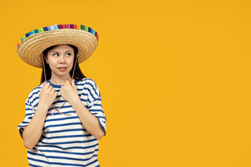 Beautiful Asian girl wearing a Mexican hat