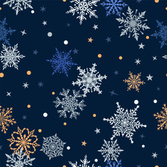 Fototapeta na wymiar Christmas seamless pattern of beautiful complex snowflakes in dark blue, yellow and white colors. Winter background with falling snow