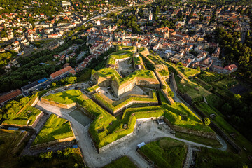 Aerial view of the city of Kłodzko and the huge fortress captured on a summer afternoon....