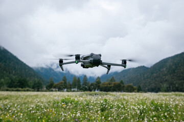 Flying drone in high altitude mountains