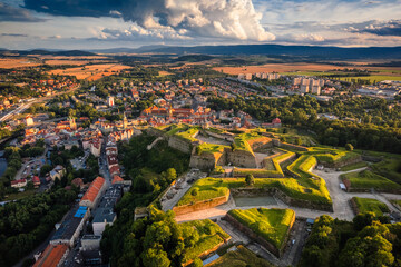 Aerial view of the city of Kłodzko and the huge fortress captured on a summer afternoon. Landscapes and attractions of Lower Silesia. - obrazy, fototapety, plakaty