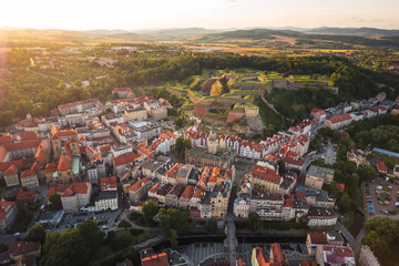 Aerial view of the city of Kłodzko and the huge fortress captured on a summer afternoon. Landscapes and attractions of Lower Silesia. - obrazy, fototapety, plakaty