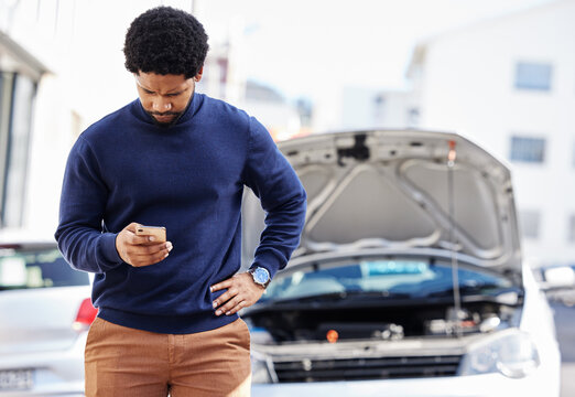 Black Man With Phone, Car Breakdown And Typing In Road With Contact, Auto Insurance And Travel. Motor Problem, Transport And Frustrated Driver On Road Checking Mobile App For Engine Repair Service.