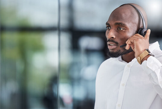 Black man, call center and thinking of solution for customer service, advisory help and FAQ questions. Serious salesman working in CRM agency for telecom consulting, tech support and communication