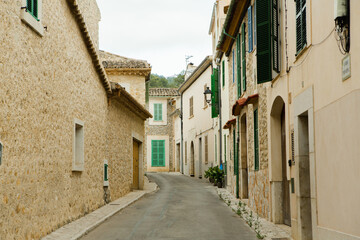 Fototapeta na wymiar View of a medieval street of the picturesque Spanish-style village Mancor de la Vall in Majorca or Mallorca island, Spain.