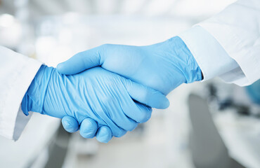 Team handshake, gloves and lab scientist partnership, agreement or collaboration on medical...