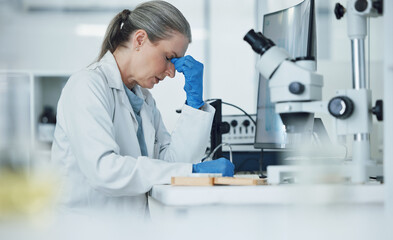 Senior woman, headache and stress from science research and work for medical analysis. Scientist,...