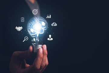 Businessman holding light bulb and brain inside, creativity and inspiration, idea and imagination. Scientific Innovation with Technological Innovation Network Analysis Solution Development