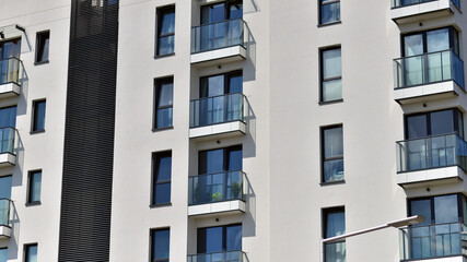 Modern apartment building in sunny day. Exterior, residential house facade.