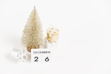 Boxing Day, wooden calendar with the date December 26 and decor on a white background. The concept of preparing for the Christmas and New Year holidays.