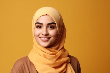 Smiling happy arab asian muslim woman in yellow hijab clothes isolated on yellow background studio portrait. Uae people middle east islam religious concept. generative AI - obrazy, fototapety, plakaty