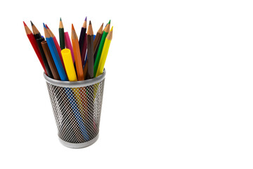 Colored pencils and felt-tip pens in a pencil holder, isolated on white background.