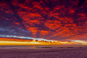 Colourful orange sunrise clouds in the sky over Miami beach. Gold Coast, Australia.