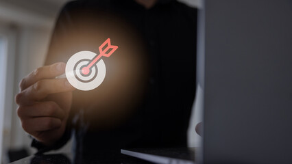 Man touching a target marketing concept on a touch screen with his finger.