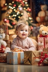 Fototapeta na wymiar Cute baby sitting under christmas tree and guardian gifts